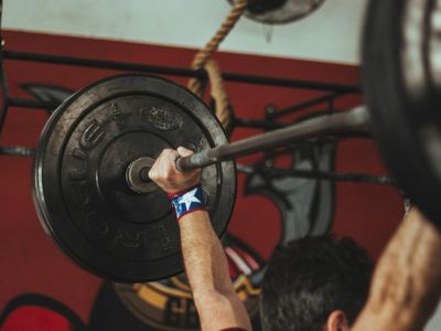 Person hands doing balance exercises in gym