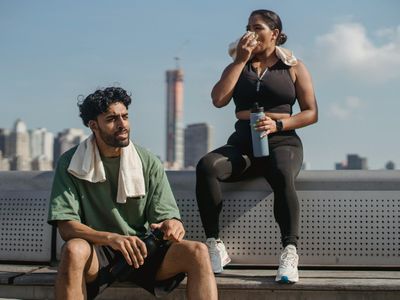Water bottle and fitness towel on bench